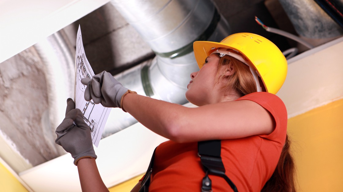 Woman checking ventilation system